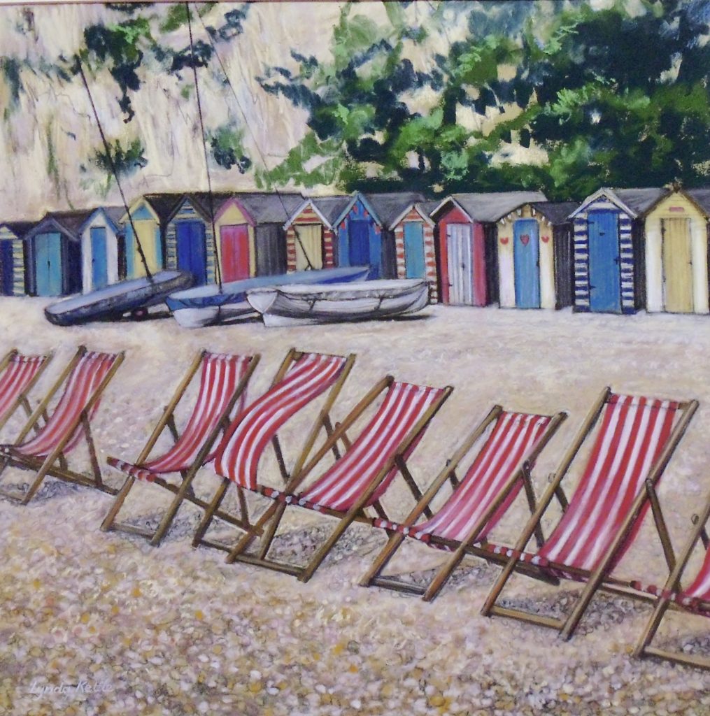 Picture of deckchairs on a beach in pastels